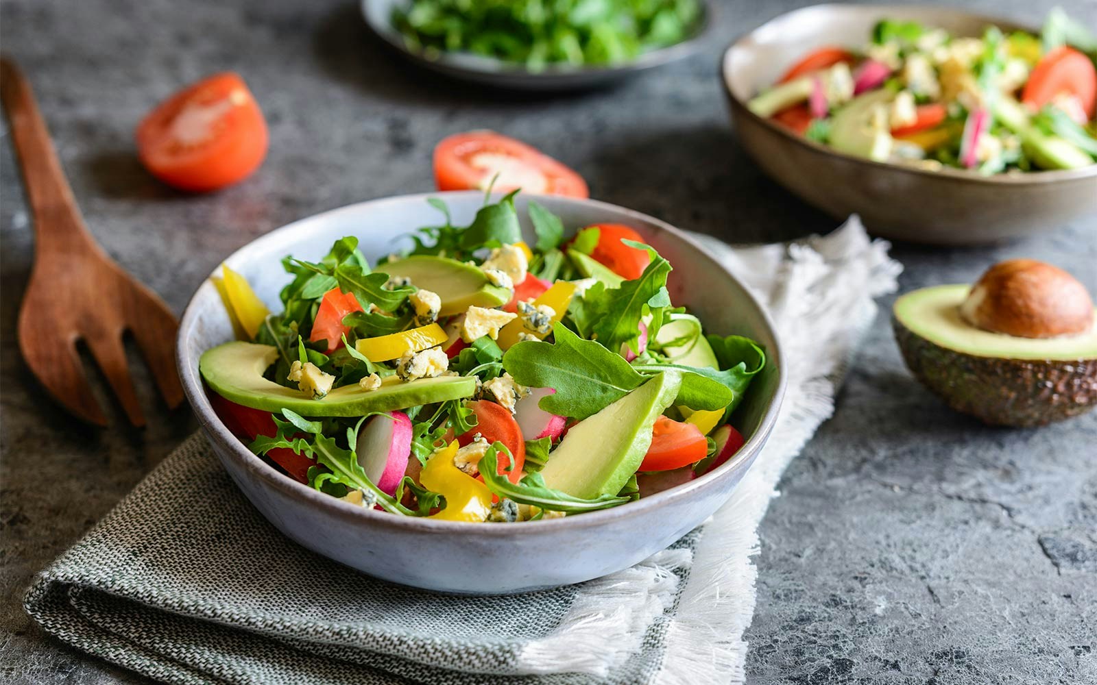 Salad with avocado, arugula, and tomatoes at International buffet, Good Old Days.