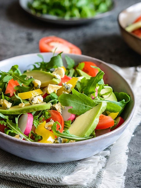 Salad with avocado, arugula, and tomatoes at International buffet, Good Old Days.