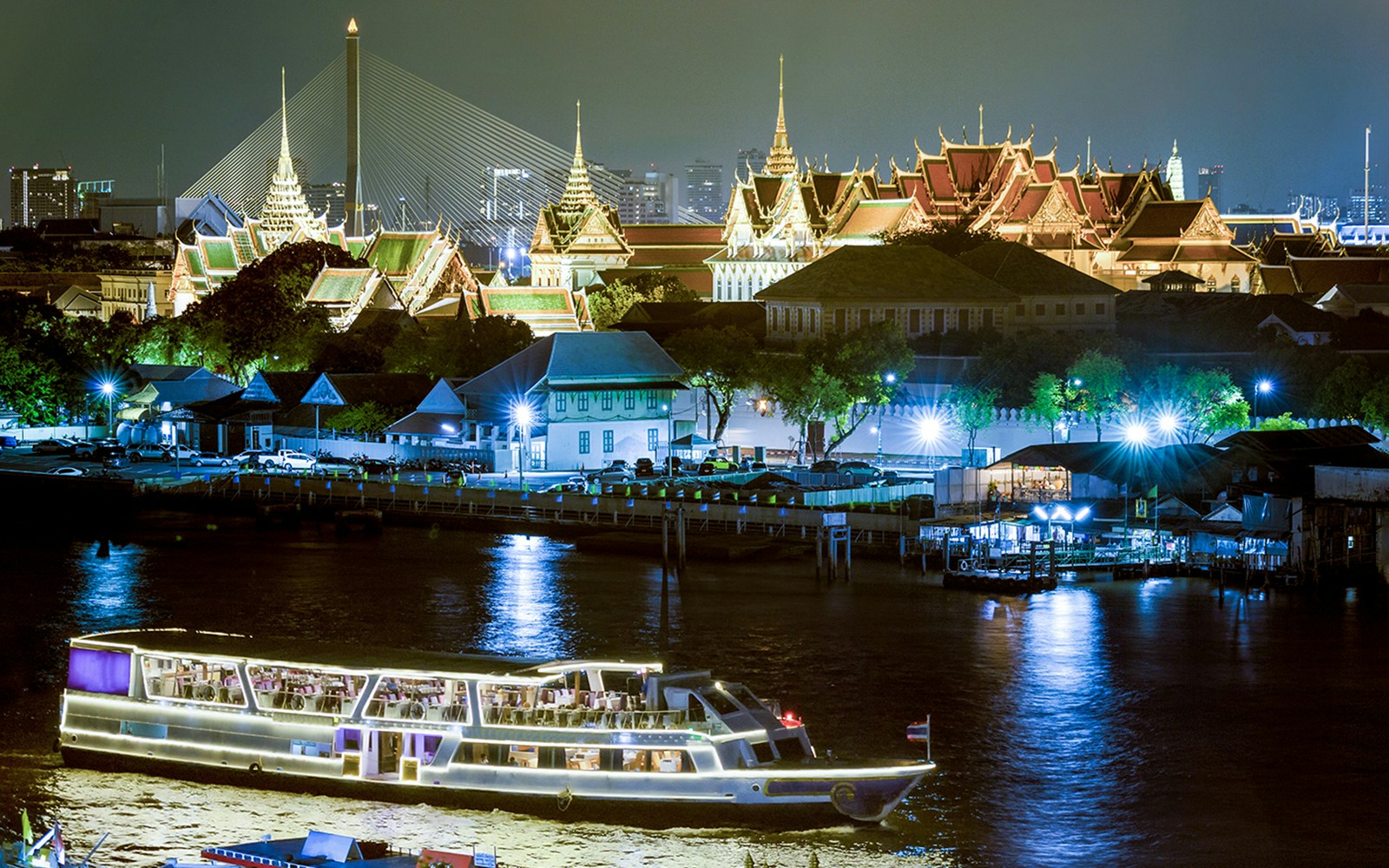 Royal Galaxy Cruise on the Chaor Phraya river with famous landmarks in the background.
