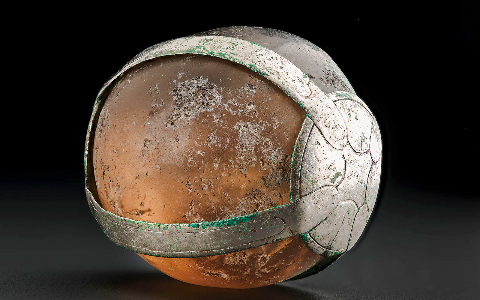 Viking Age rock crystal pendant with intricate metalwork.