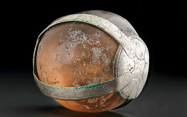 Viking Age rock crystal pendant with intricate metalwork.