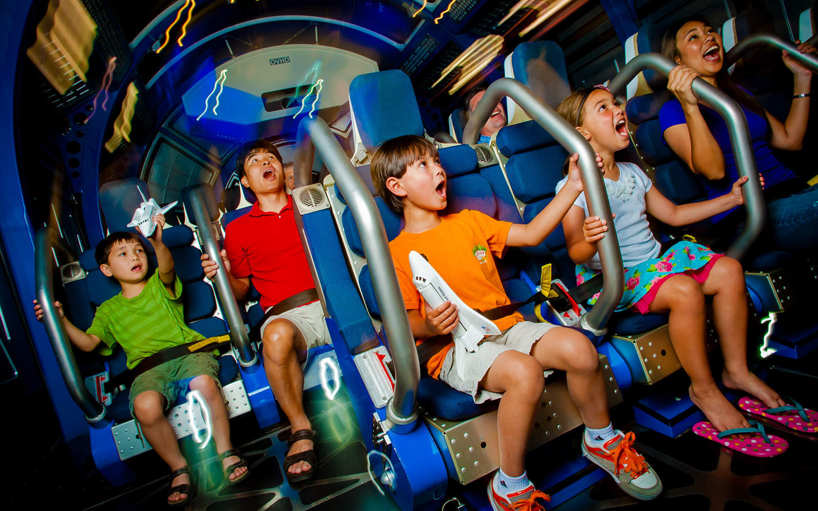 Kids experiencing Space Shuttle Atlantis simulator ride.