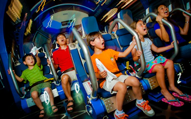 Kids experiencing Space Shuttle Atlantis simulator ride.