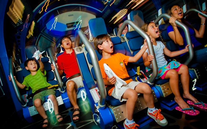 Kids experiencing Space Shuttle Atlantis simulator ride.