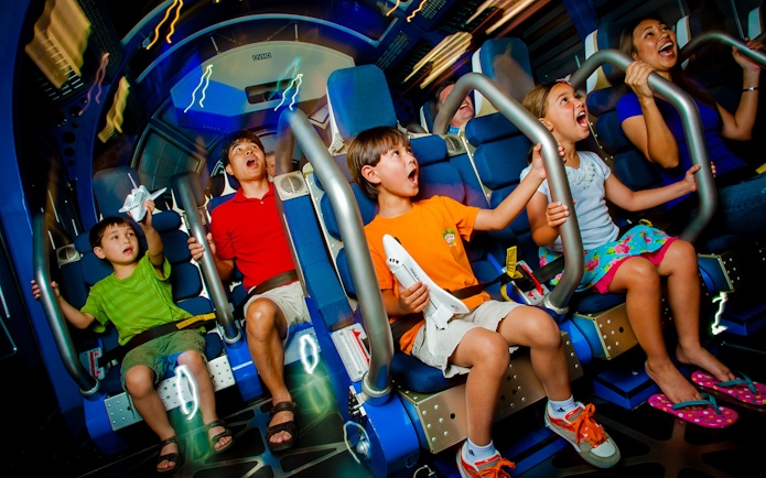 Kids experiencing Space Shuttle Atlantis simulator ride.