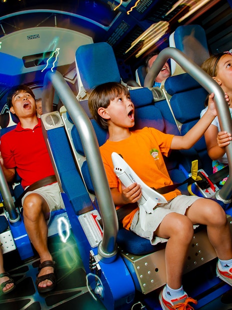 Kids experiencing Space Shuttle Atlantis simulator ride.
