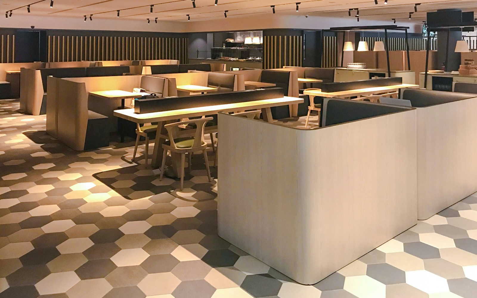 Dining area at BLOSSOM by SATS, Plaza Premium Lounge, Singapore with modern seating.