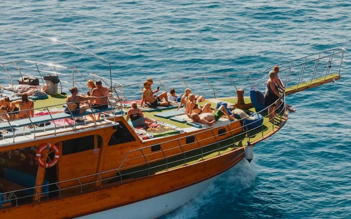 People relaxing on a boat deck during Alanya Boat Day Tour.