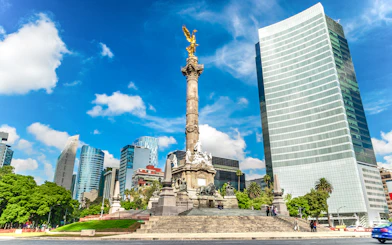 Angel of Independence monument in Mexico City with surrounding skyscrapers.