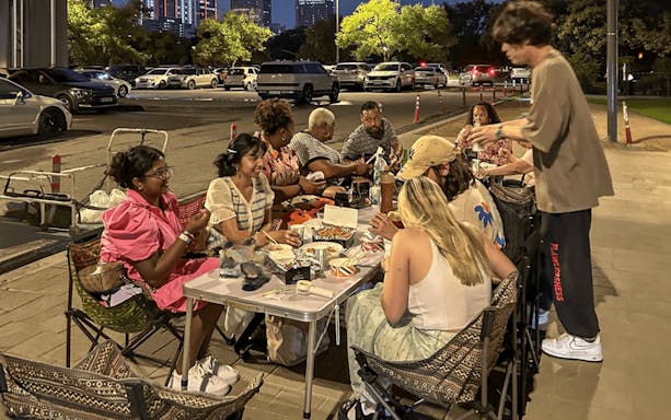 Group enjoying a picnic at Hangang Park during Han River night cruise.