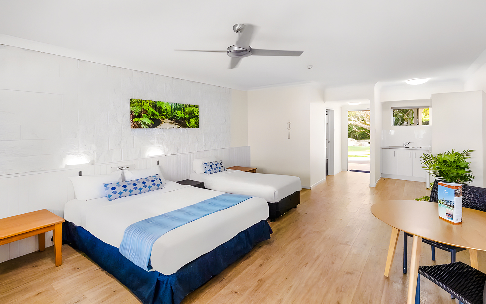 K'gari Beach Resort room with two beds, kitchenette, and garden view.