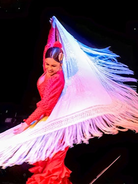 Flamenco dancer performing with a shawl in Barcelona.