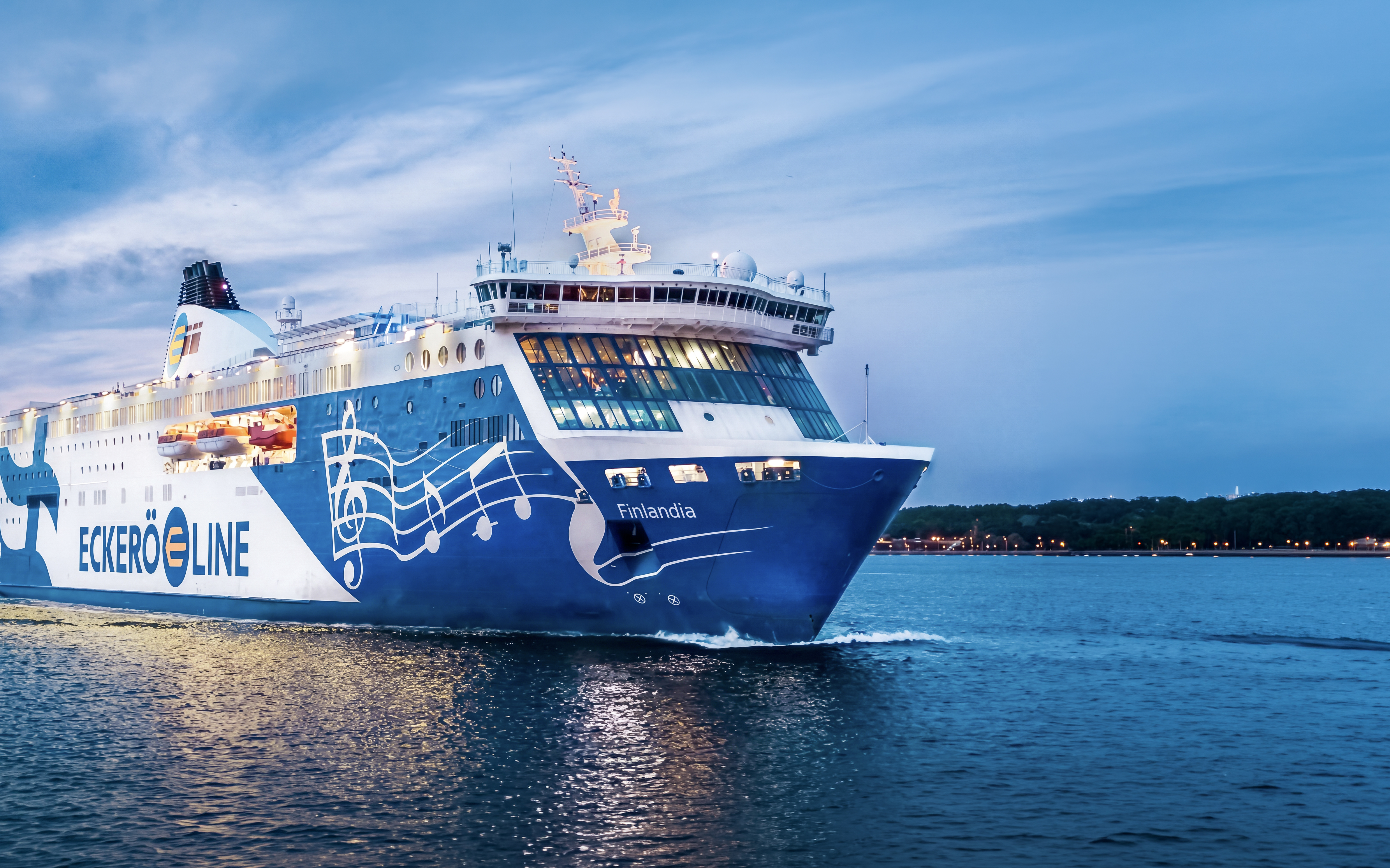 Ferry sailing from Helsinki to Tallinn at dusk.