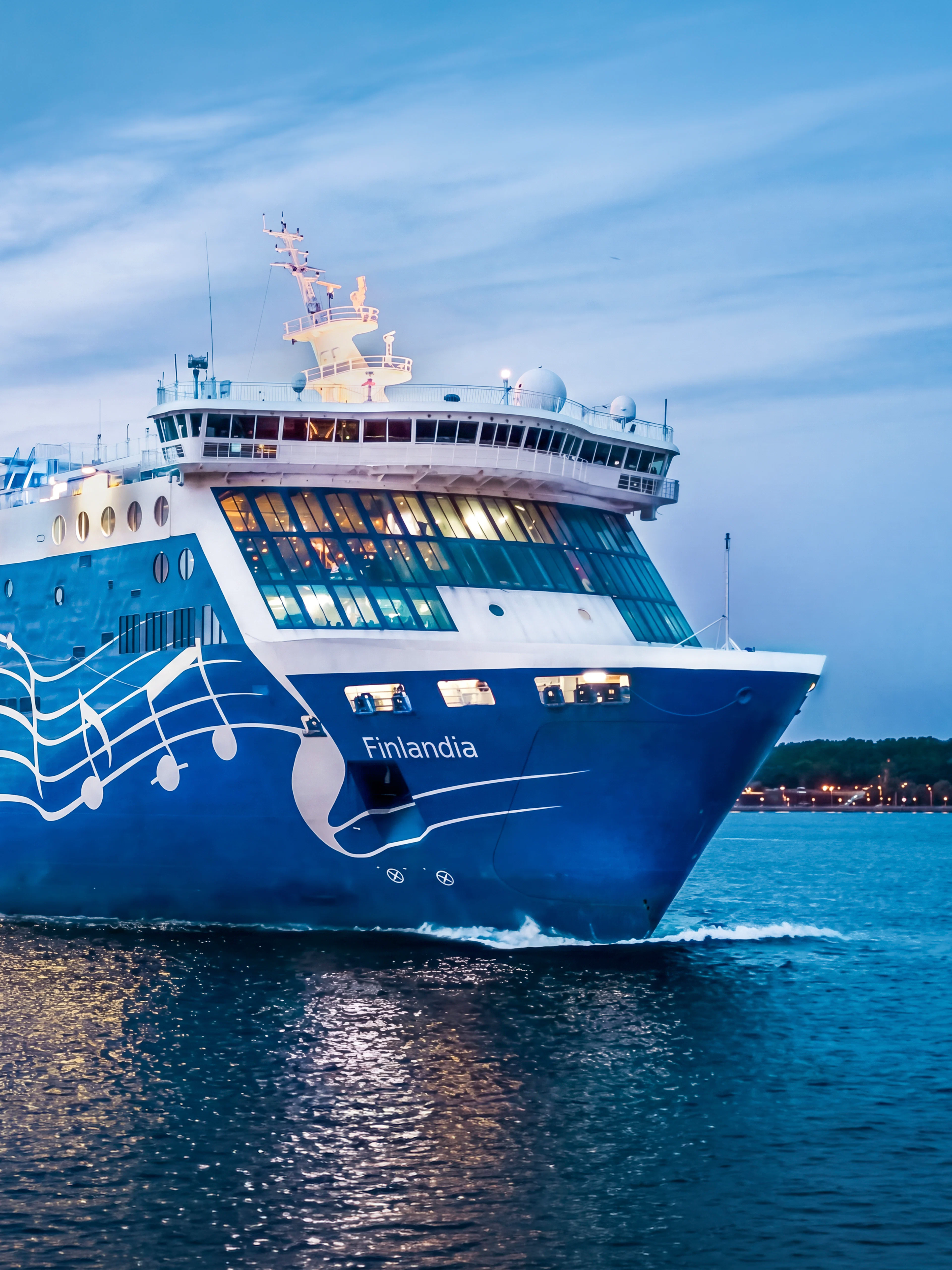 Ferry sailing from Helsinki to Tallinn at dusk.