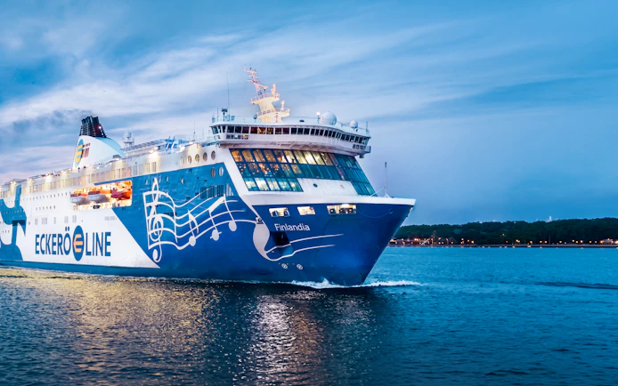 Ferry sailing from Helsinki to Tallinn at dusk.