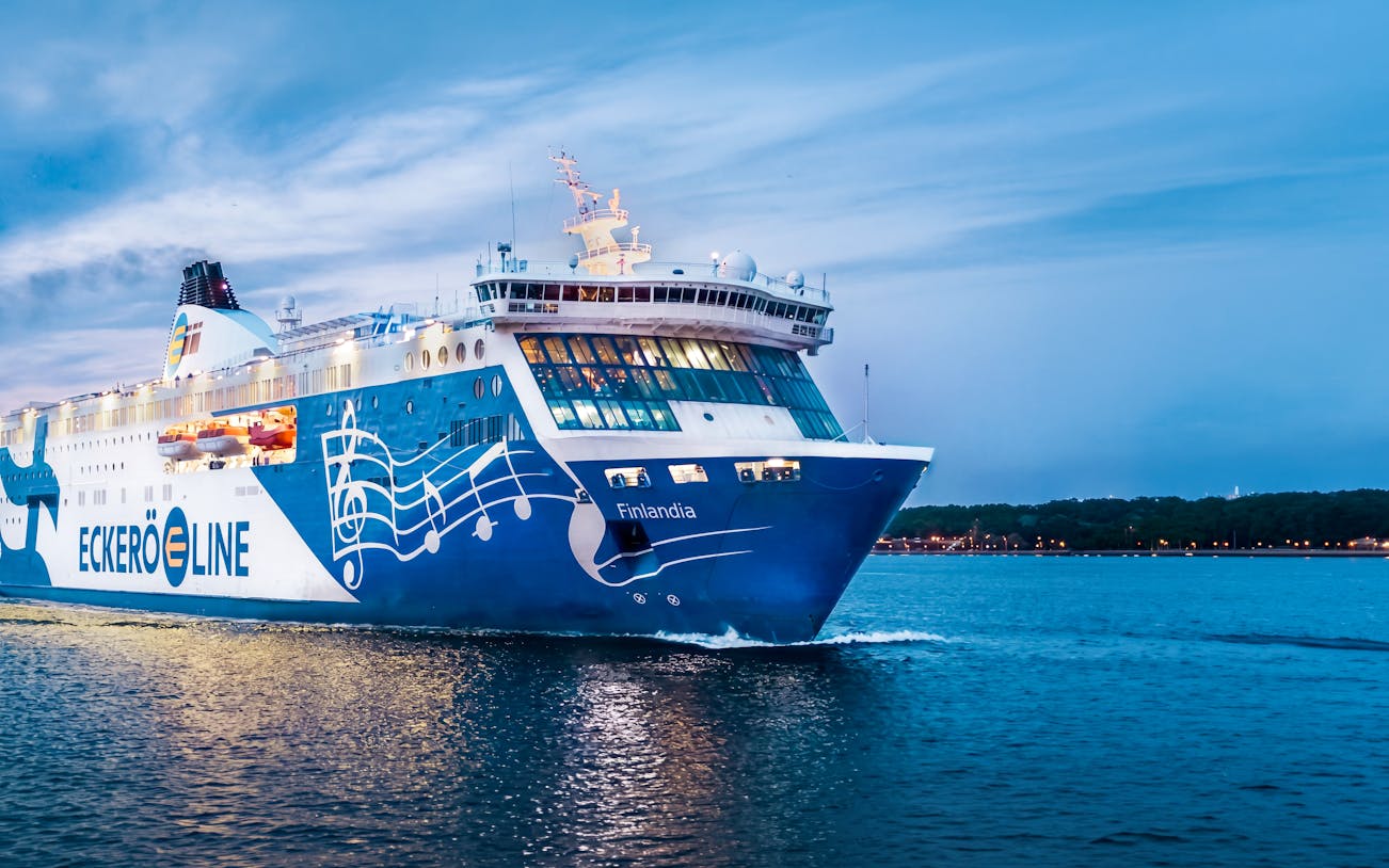 Ferry sailing from Helsinki to Tallinn at dusk.