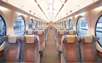 Interior of Nankai Limited Express train with rows of seats, Kansai Airport to Namba Station.