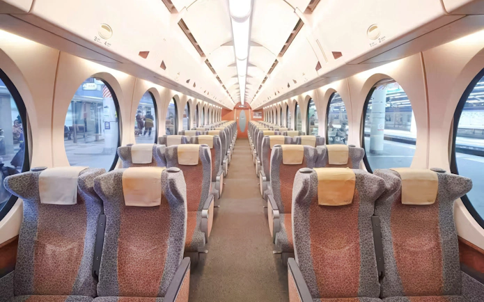Interior of Nankai Limited Express train with rows of seats, Kansai Airport to Namba Station.