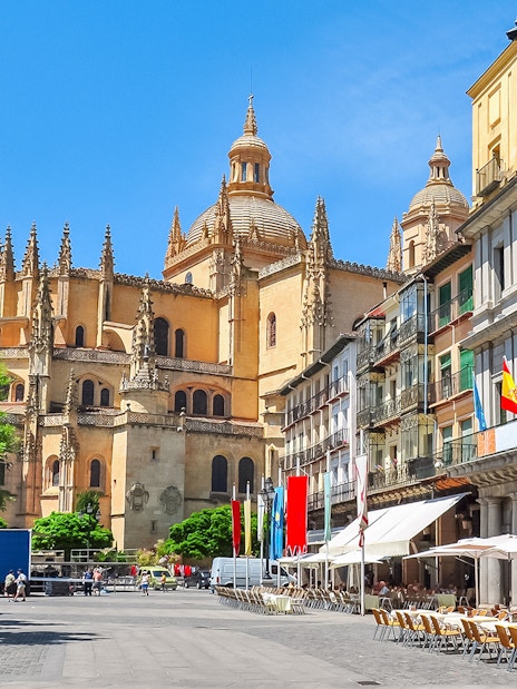 Segovia main square with cathedral and outdoor cafes.