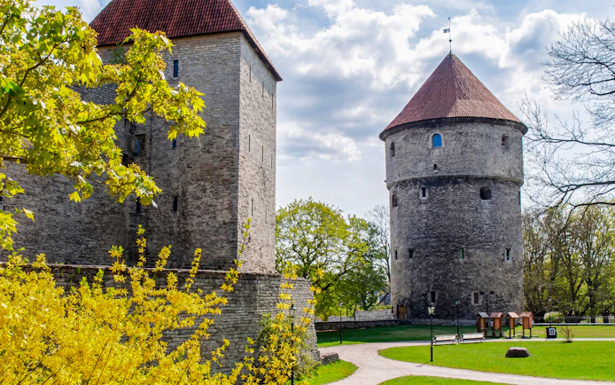Kiek in de Kök Fortifications Museum towers surrounded by greenery in Tallinn, Estonia.