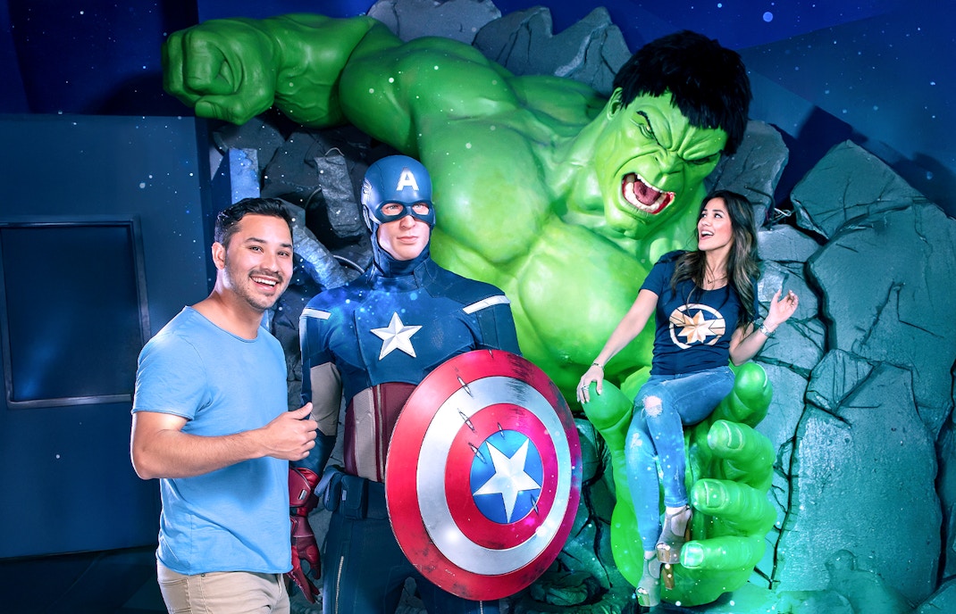 Captain America and Hulk wax figures at Madame Tussauds, New York with visitors.