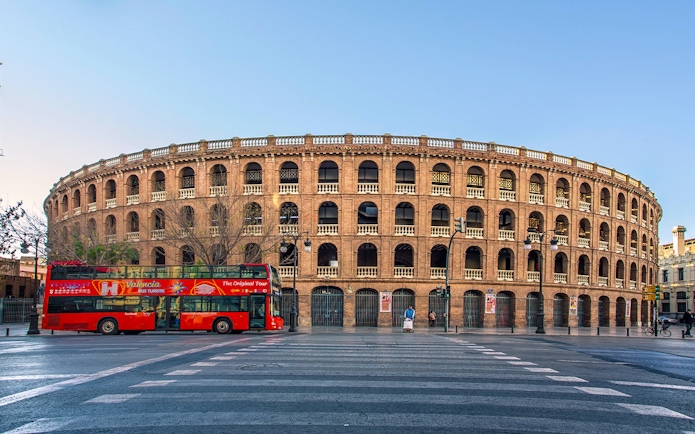 Valencia tour bus in front of Plaza de Toros, Spain.