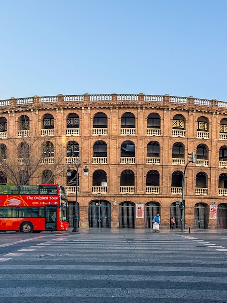 Valencia tour bus in front of Plaza de Toros, Spain.