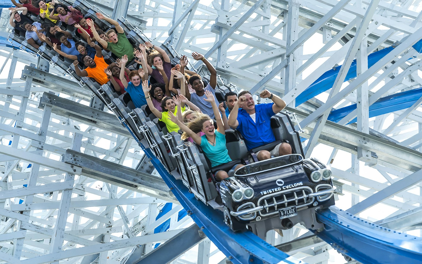 Riders enjoying the Twisted Cyclone roller coaster at Six Flags Over Georgia.