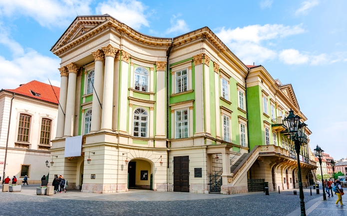 Estates Theatre in Prague's old town with neoclassical architecture.