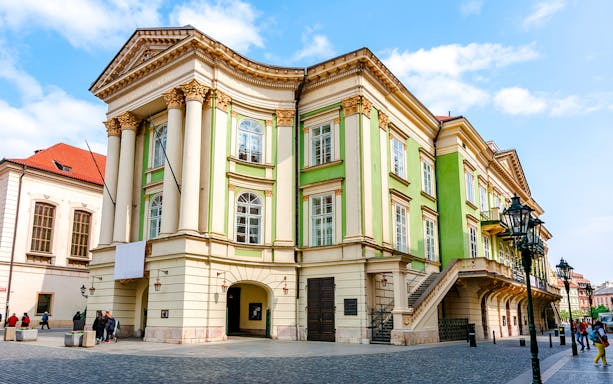 Estates Theatre in Prague's old town with neoclassical architecture.