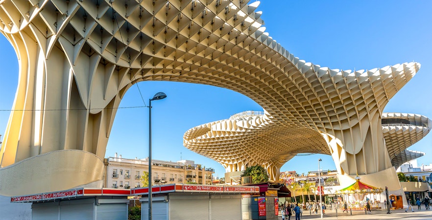 Setas de Sevilla wooden structure in Seville, Spain, with people walking below.