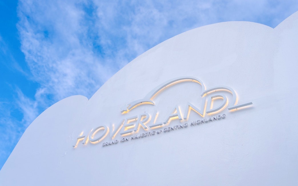 Hoverland Genting sign against a blue sky.