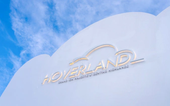Hoverland Genting sign against a blue sky.