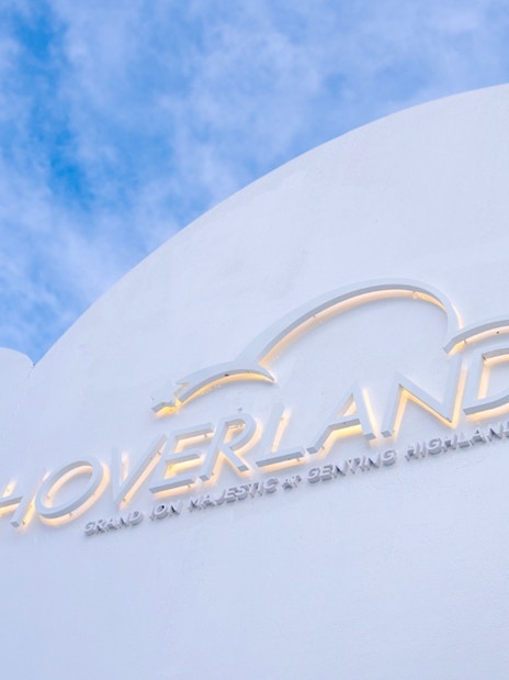 Hoverland Genting sign against a blue sky.