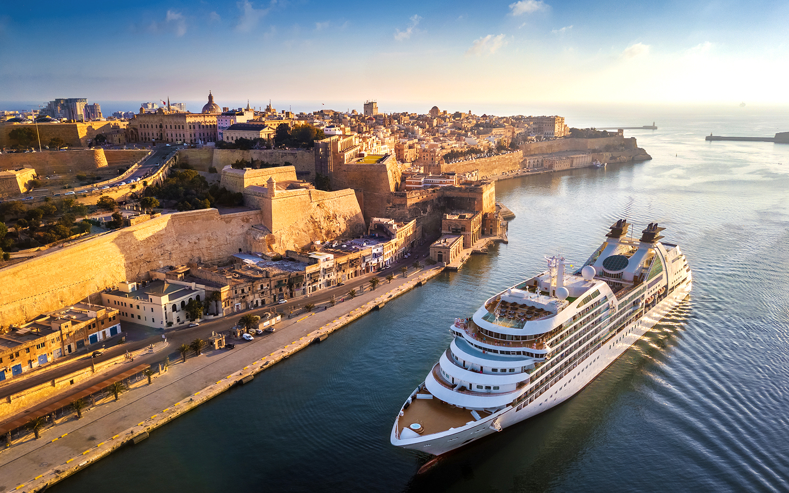 Malta harbor view with cruise ship, historic buildings, and blue sea on a one-day Malta cruise.