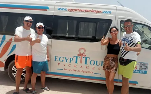 Private transfer van with tourists in Luxor for Makadi Bay trip.