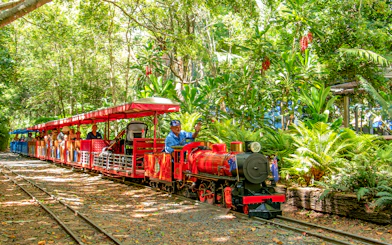 Currumbin Wildlife Sanctuary train ride through lush greenery.