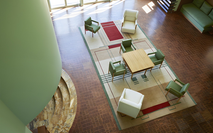 Villa Cavrois interior with modern seating and geometric rug design.