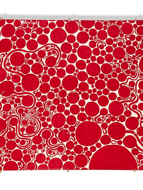Red polka dot artwork by Yayoi Kusama at Moco Museum London.