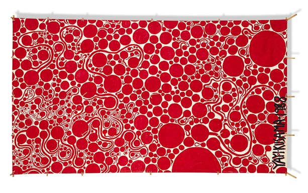 Red polka dot artwork by Yayoi Kusama at Moco Museum London.