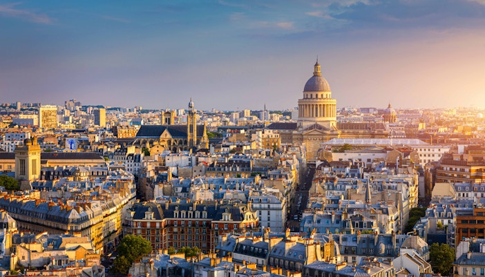 Latin Quarter Paris street scene with historic buildings and bustling cafes.