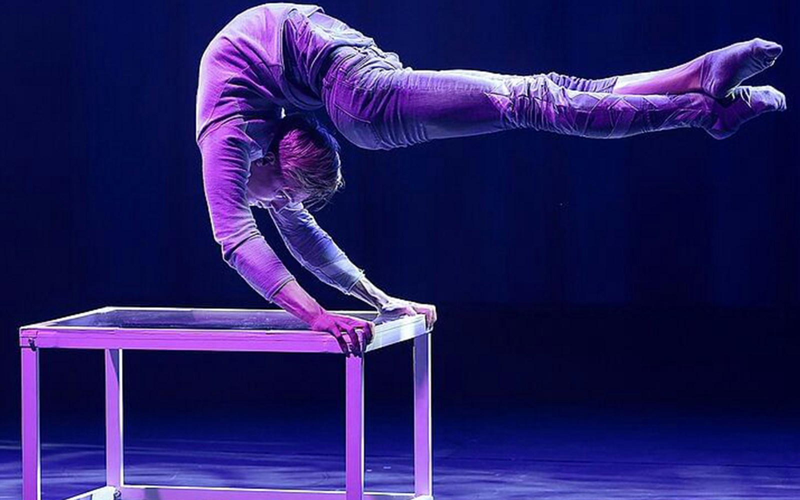 Performer balancing on hands at Big Apple Circus Holiday Show.