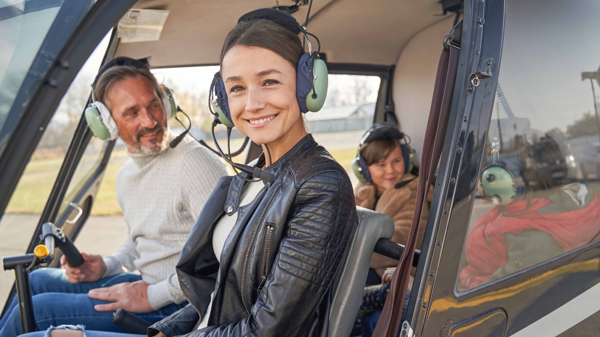 Family enjoying a helicopter tour in New York.