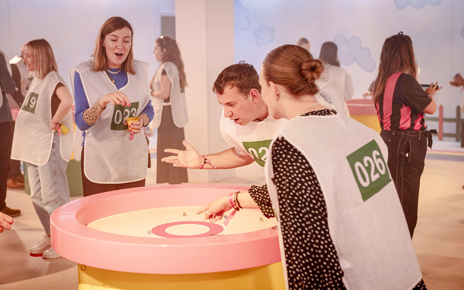 Participants playing marbles at Squid Games experience in London.