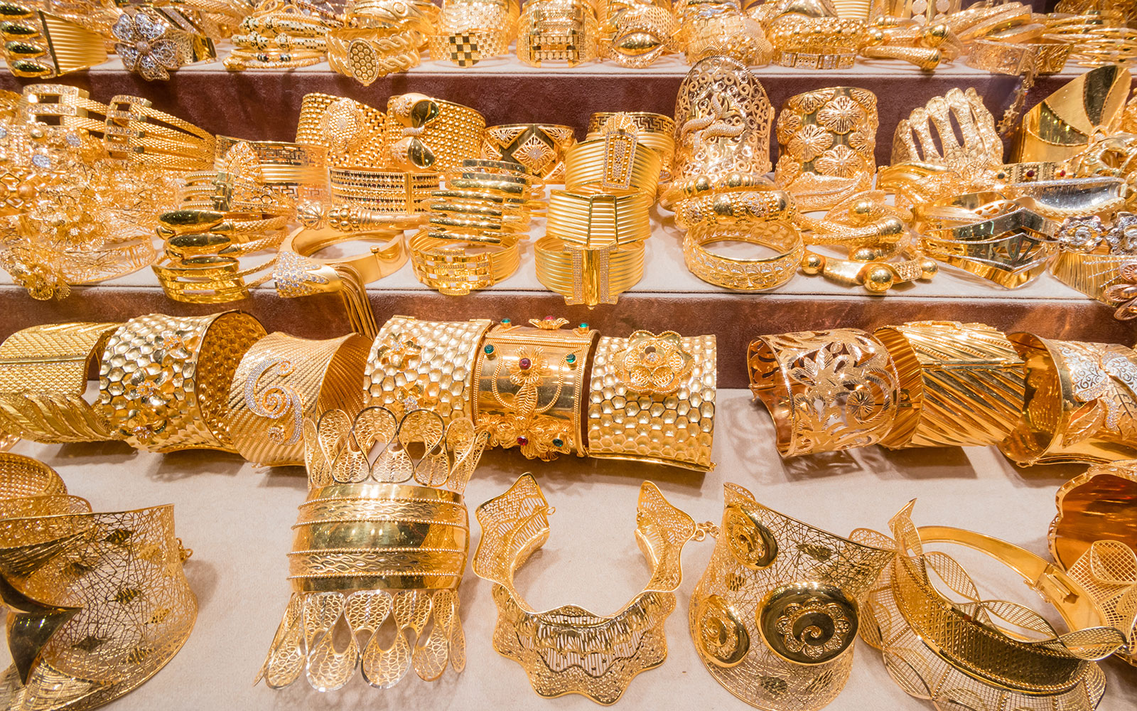 Gold jewelry display at Dubai Gold Souk during full day tour.