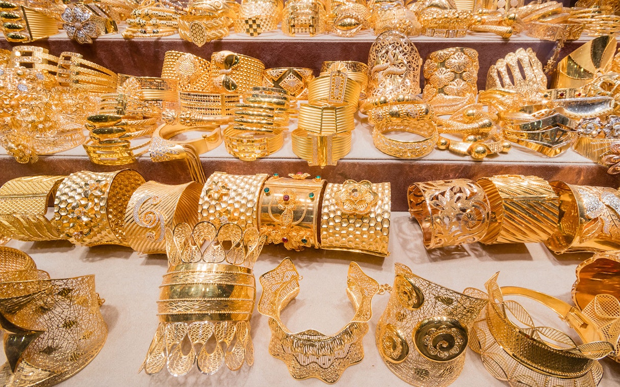 Gold jewelry display at Dubai Gold Souk during full day tour.