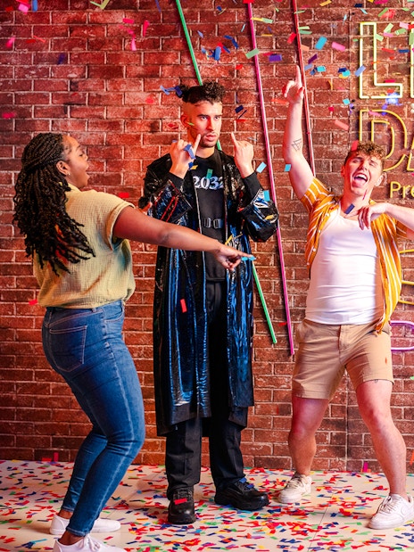 Guests dancing with confetti at Madame Tussauds Orlando party exhibit.