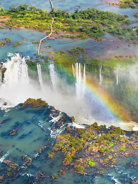 Aerial view of Iguazu Falls with rainbow, Argentina-Brazil border.