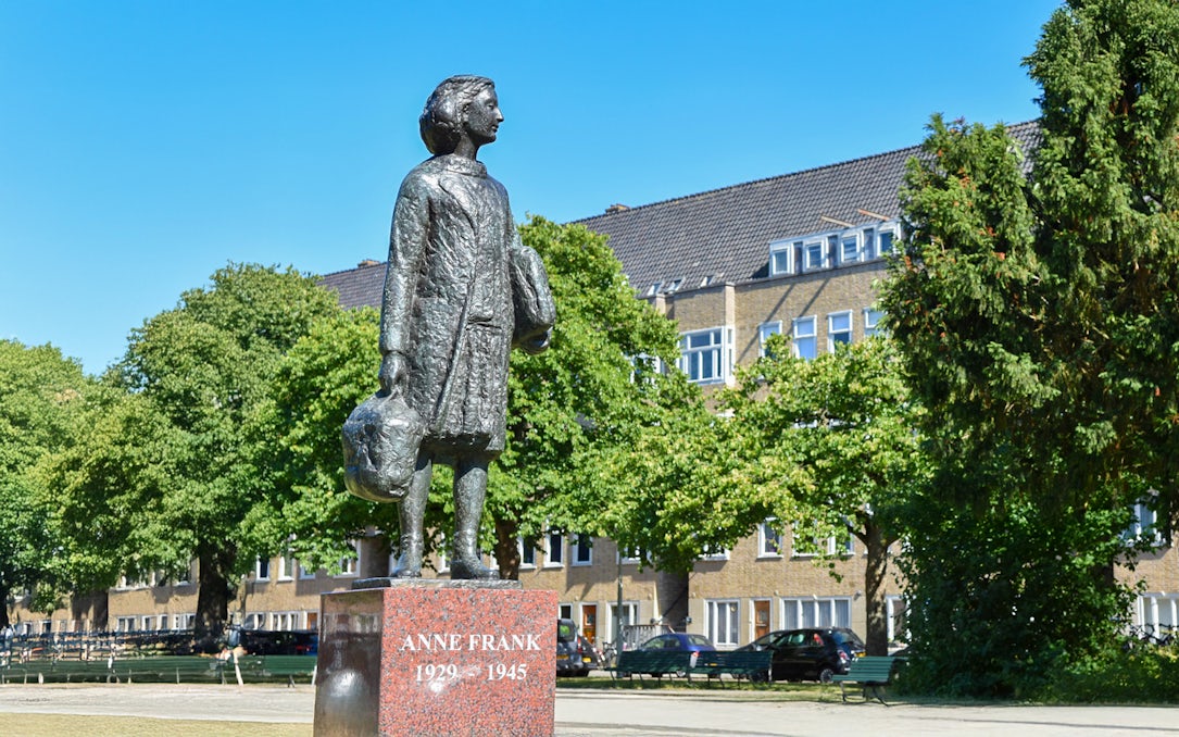 Anne Frank statue in Amsterdam neighborhood on walking tour.