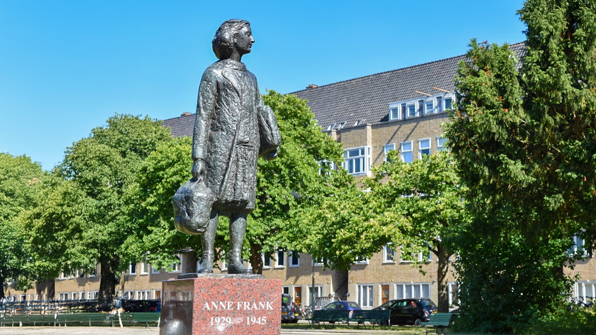 Anne Frank statue in Amsterdam neighborhood on walking tour.